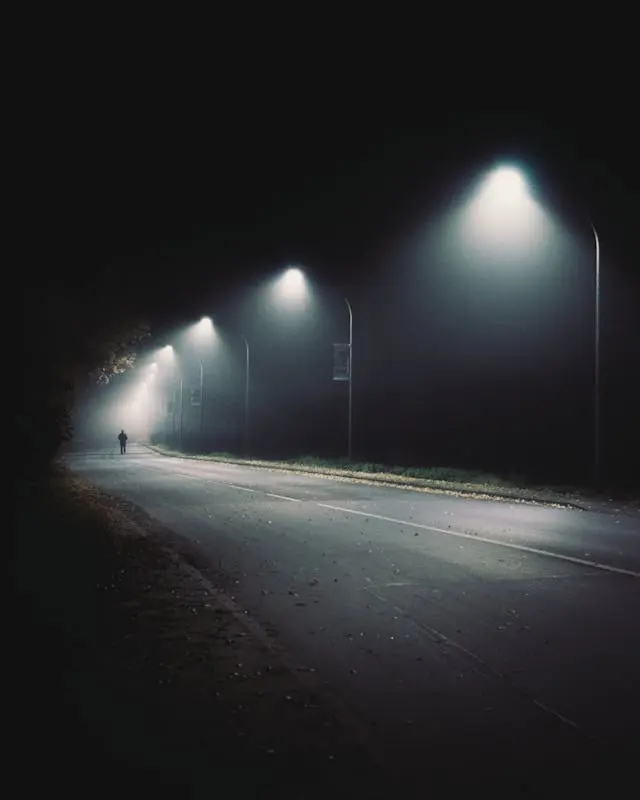 Well-lit street at night, improving visibility and safety